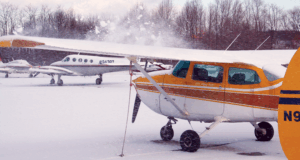 GA plane with snow on wing